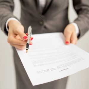 Woman offering to sign contract